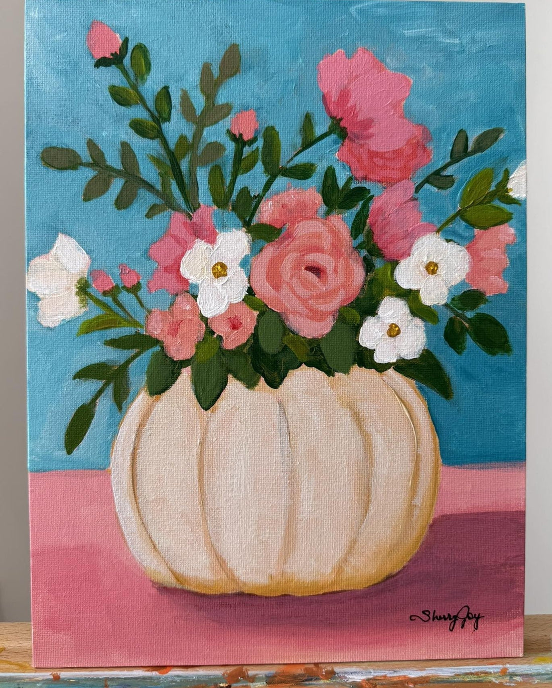 Painting of a white pumpkin with pink and coral flowers