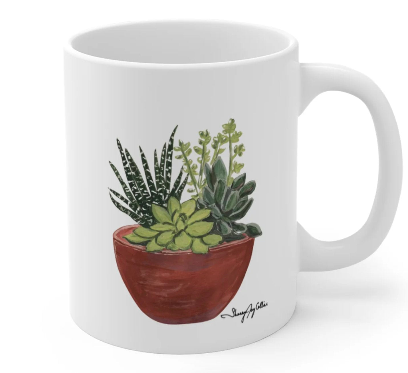 Succulent Love Mug, a white mug with a painting of green succulents.